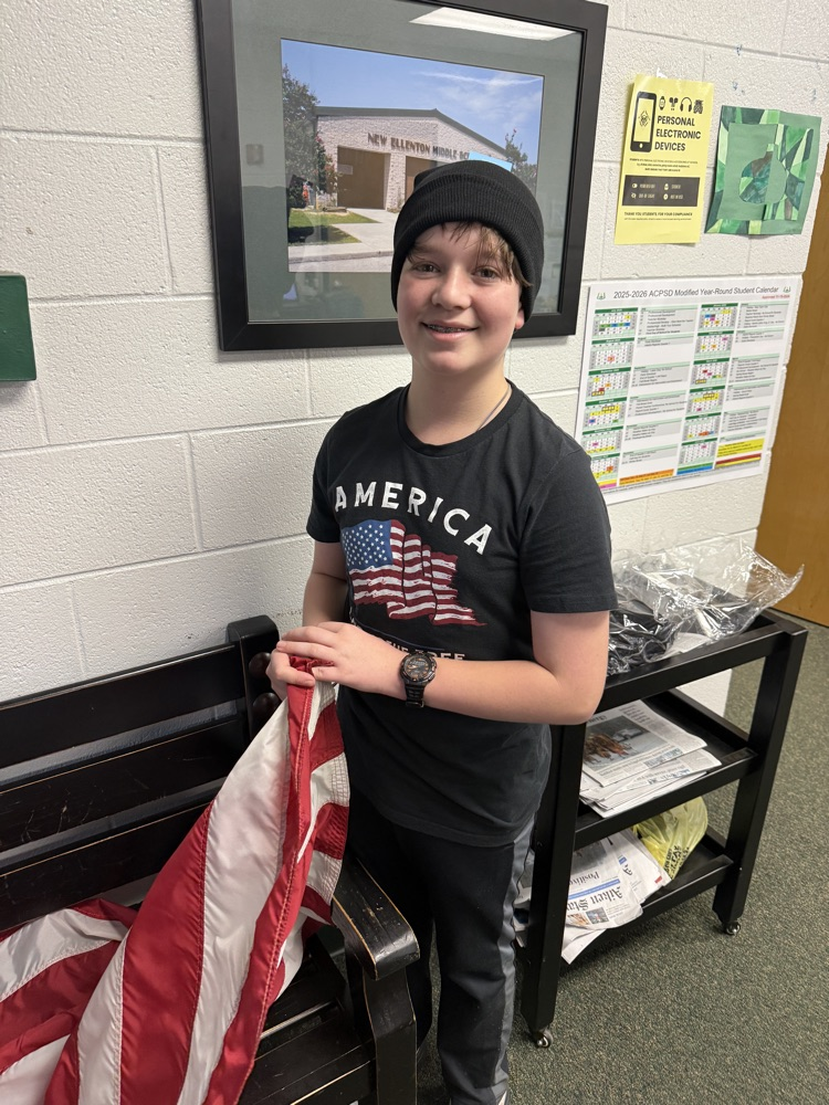 students posing for a picture wearing a beanie 
