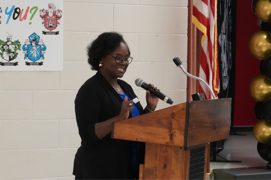 Board member speaking at 100 year anniversary event.