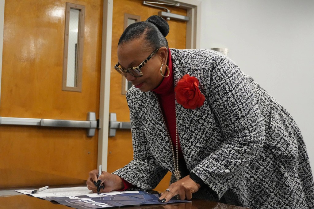 Board member smiling.