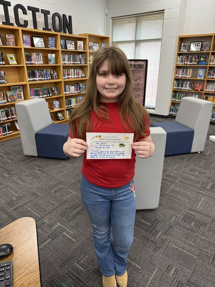 student holding a certificate 