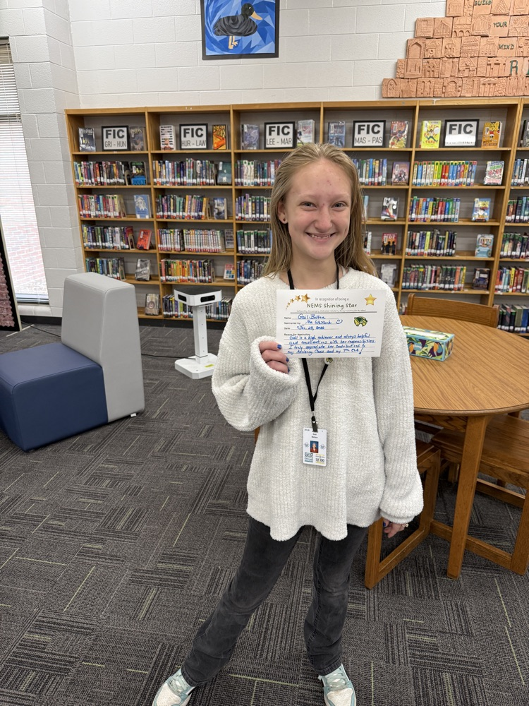student holding a certificate 