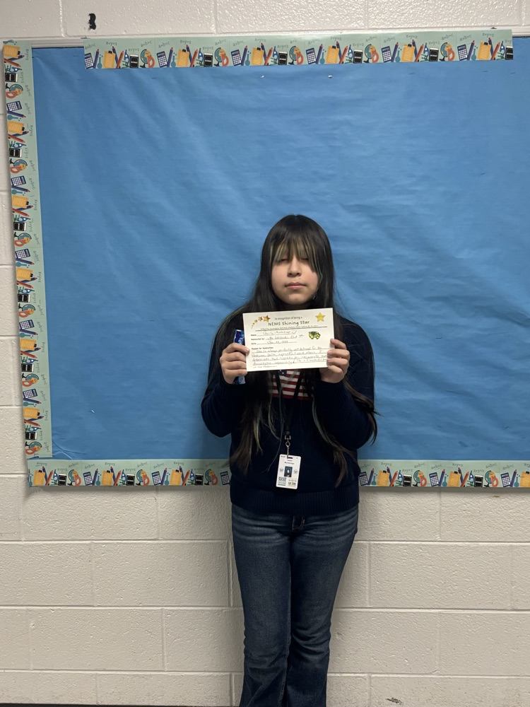 student holding a certificate 