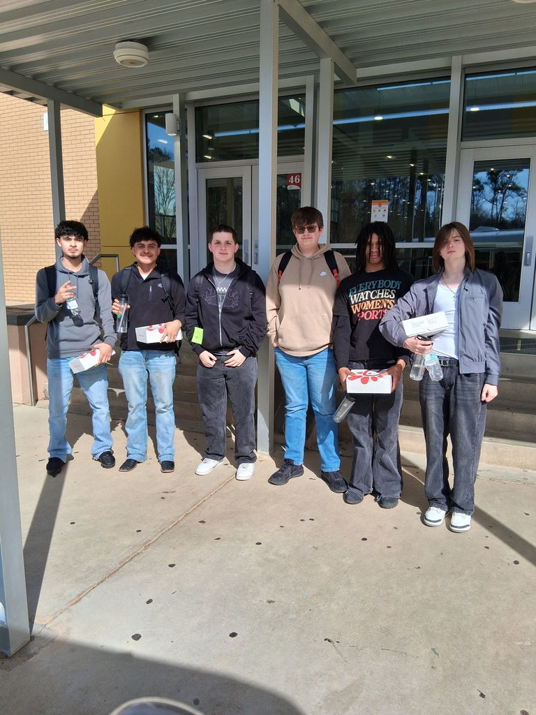 6 Students standing with Chick-Fil-A Lunch. 