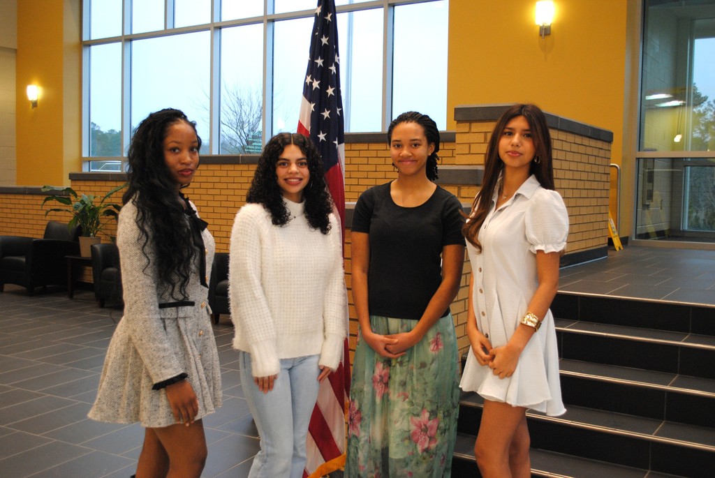 Miss NASH Contestants standing on stairs.