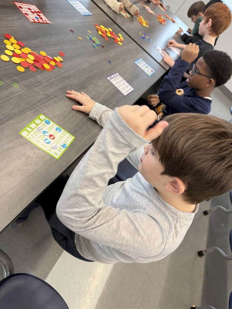 children playing bingo in the school caferia