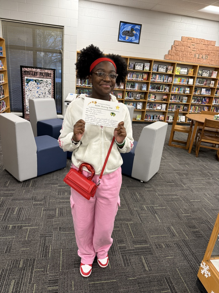 student holding certificate 