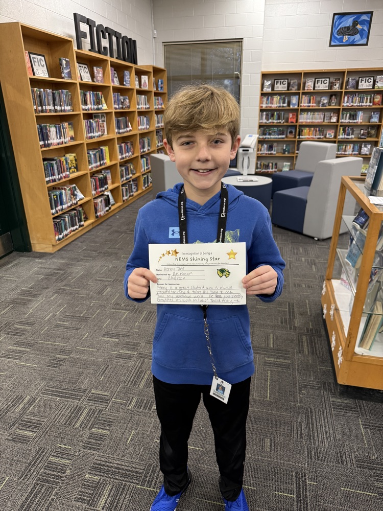 student holding certificate 