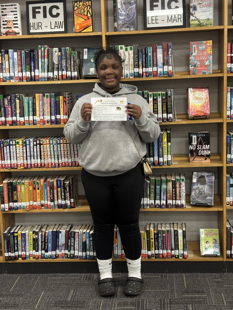 student holding certificate 