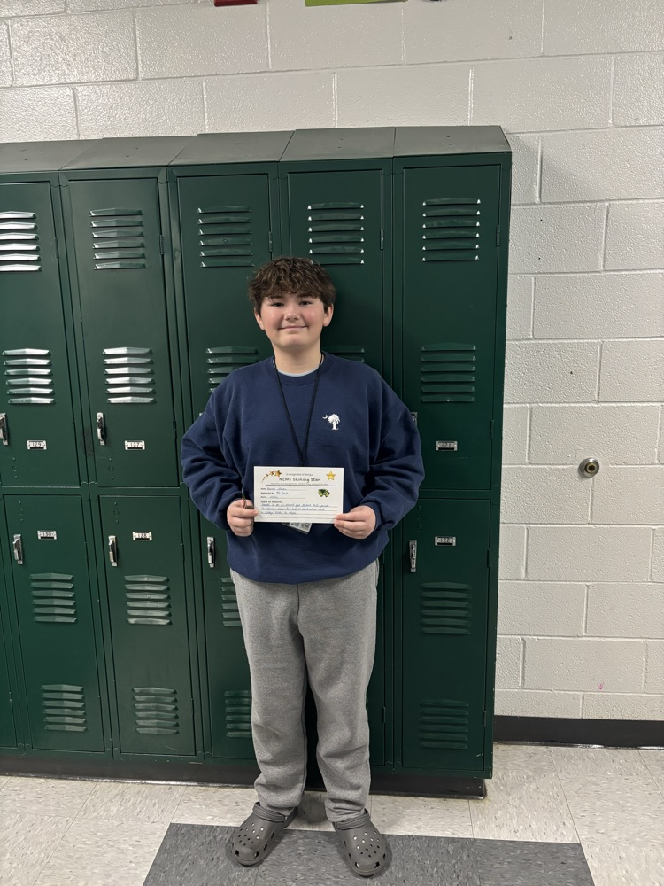 student holding certificate 