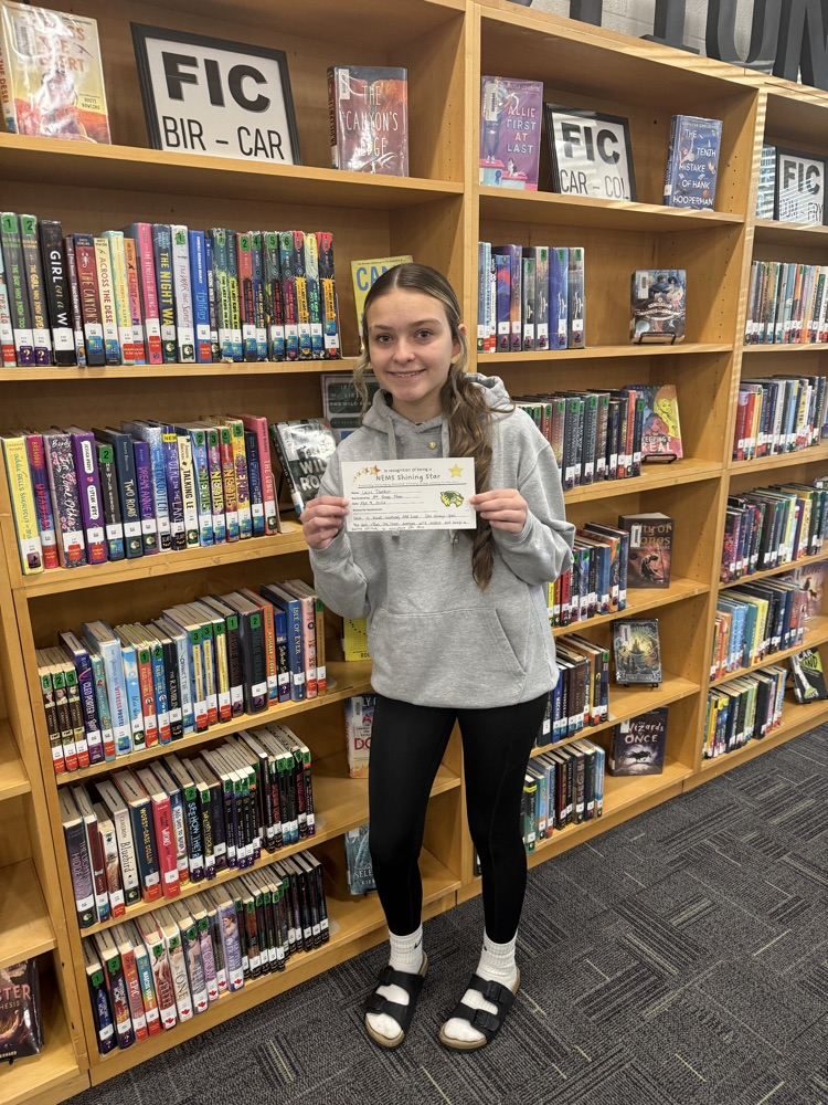 student holding certificate 