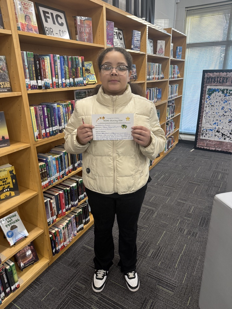 student holding certificate 