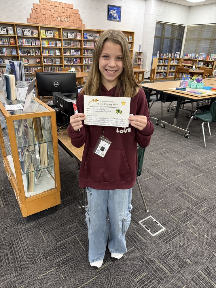 student holding certificate 