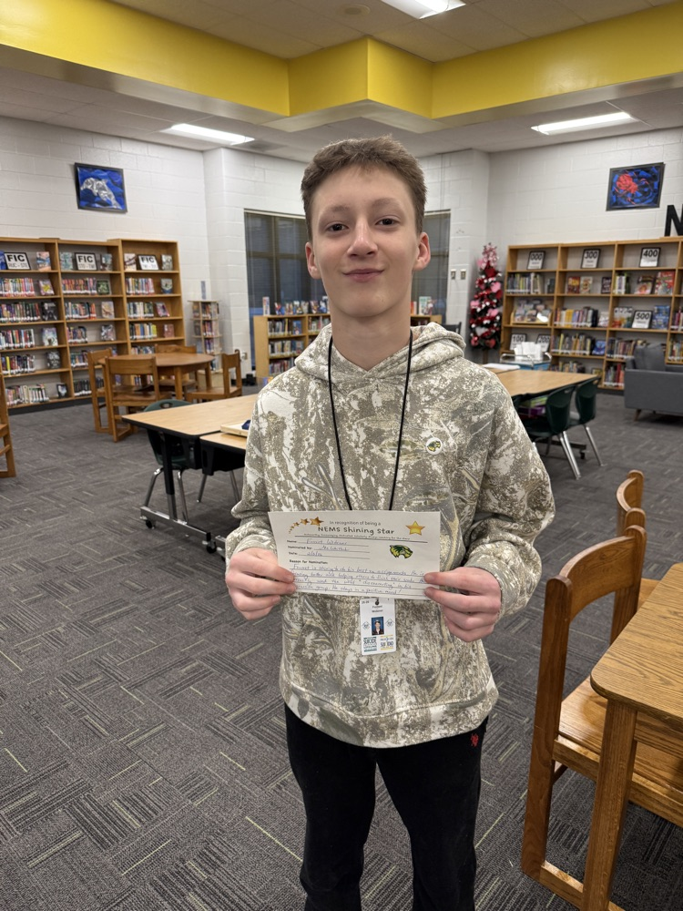 student holding certificate 
