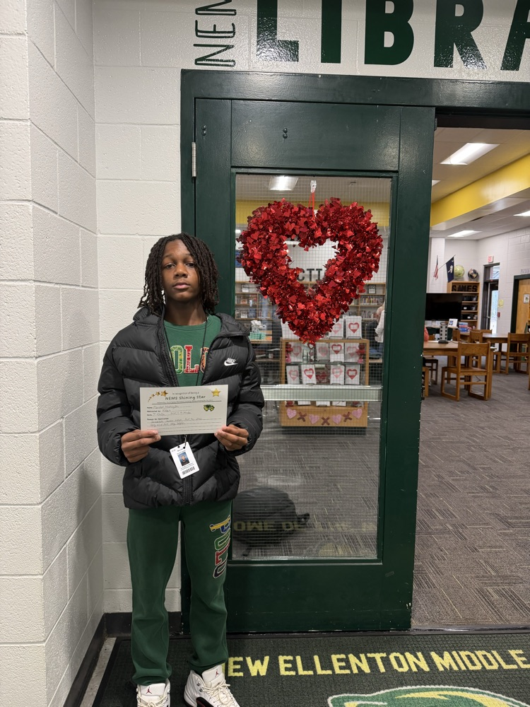 student holding certificate 