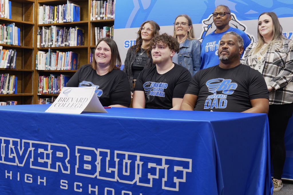 Adrian Gray smiles with his immediate family.