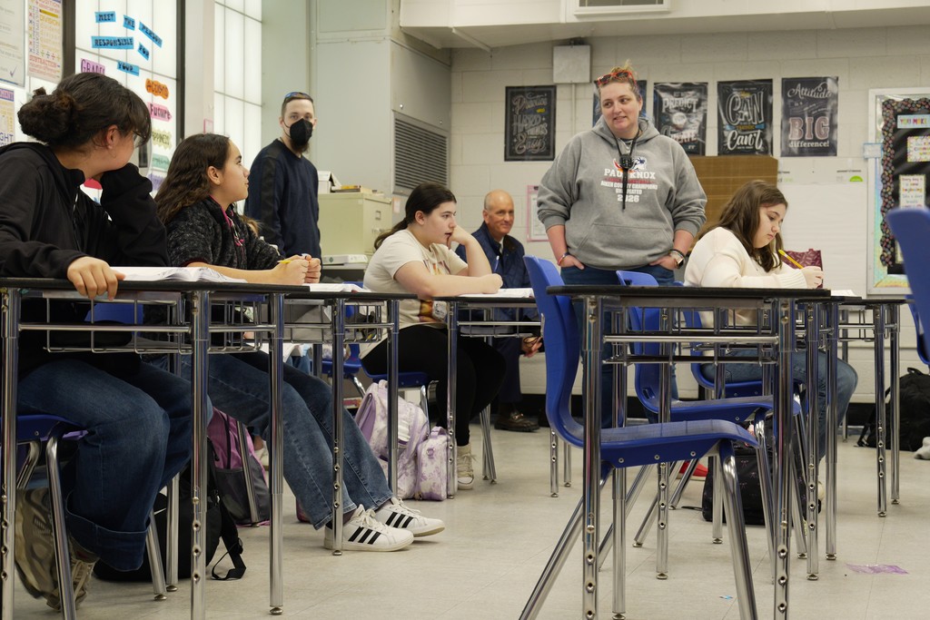 Heather Parliament walks around the classroom.
