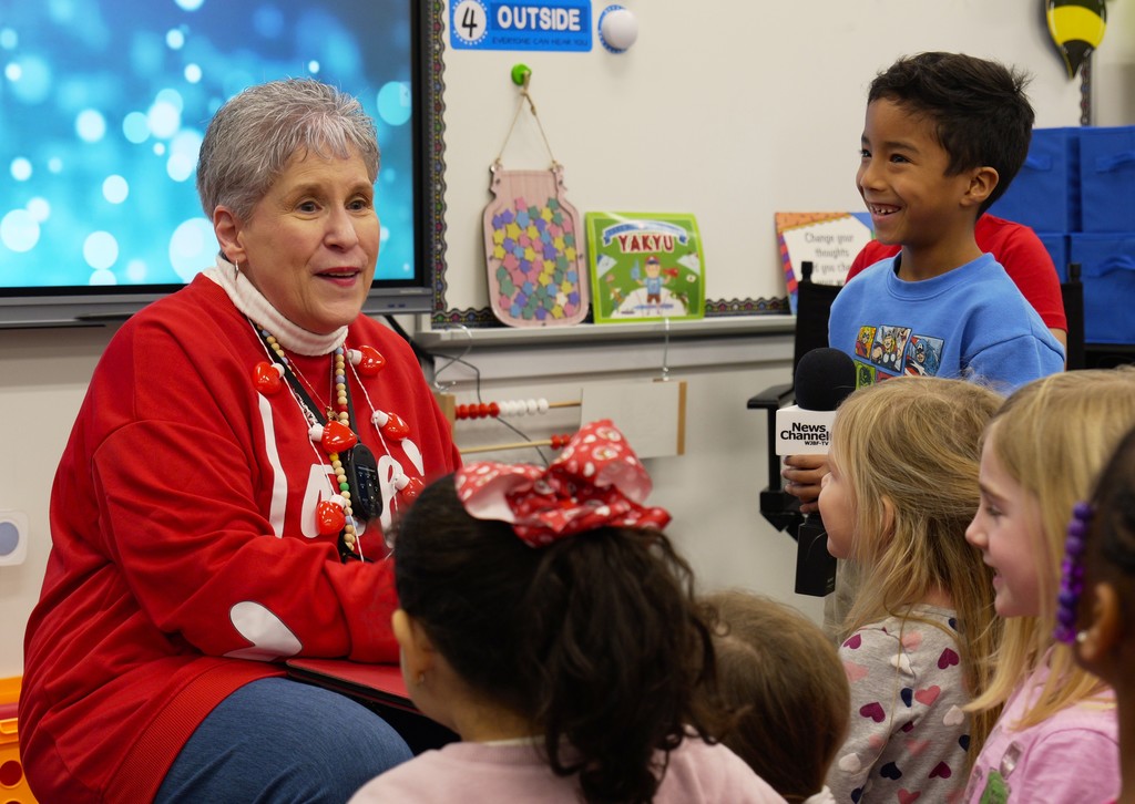 Christine Witt speaks with her kindergarten students.