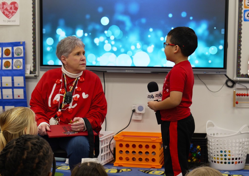 Christine Witt speaks with her students.