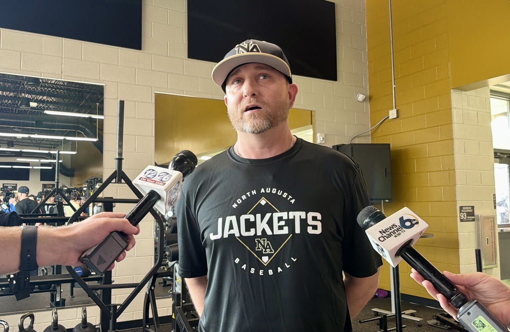 Head coach Kevin Lynn interviewed by local media about six student athlete signees.