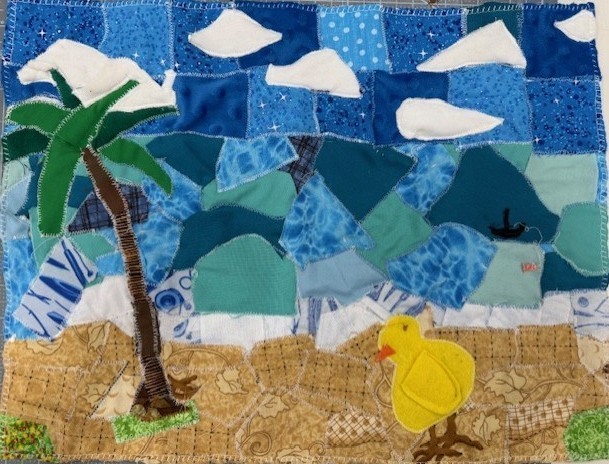 Fabric design with blue and black pieces.