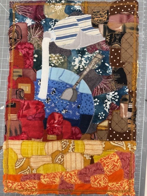 Fabric design with blue and black pieces.