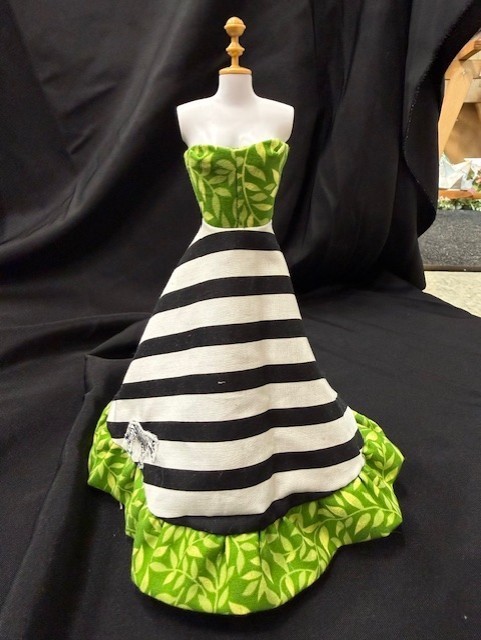 Dress on barbie size mannequin. 