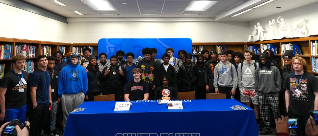 Silver Bluff football teammates smile for group photo.