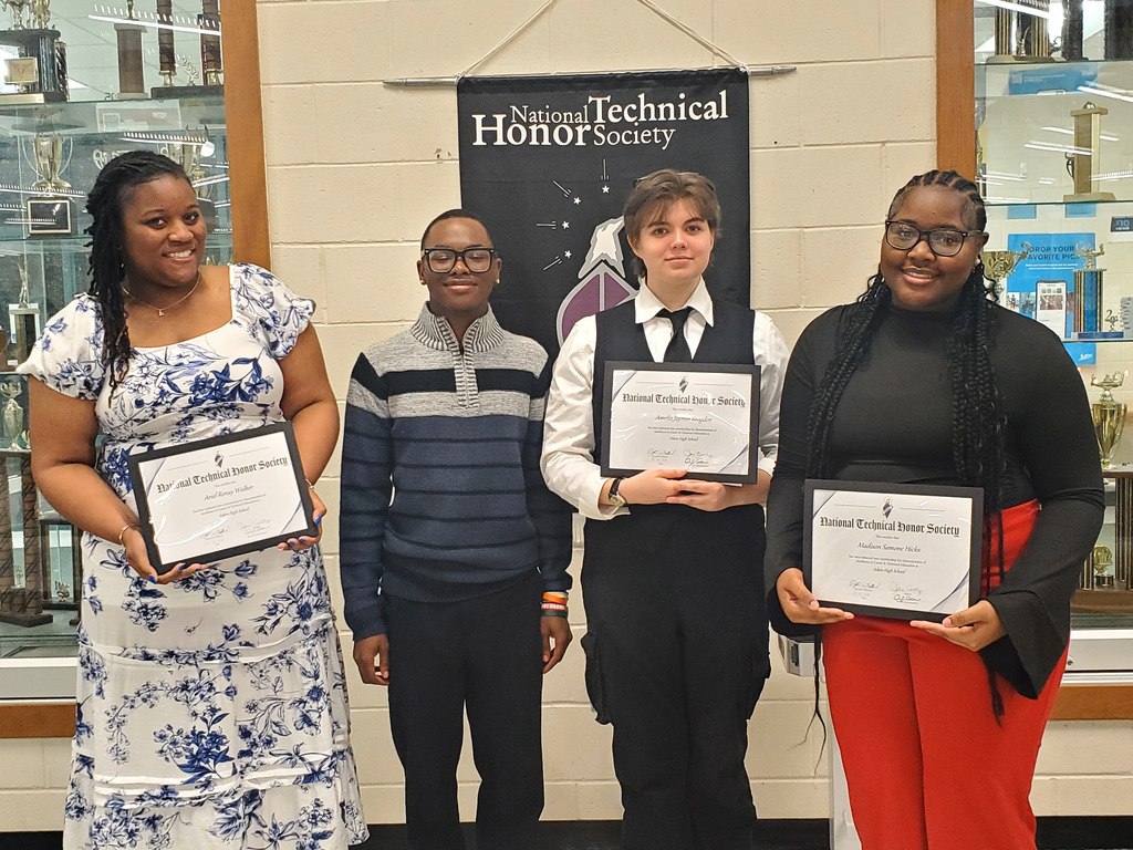 Students holding certificates