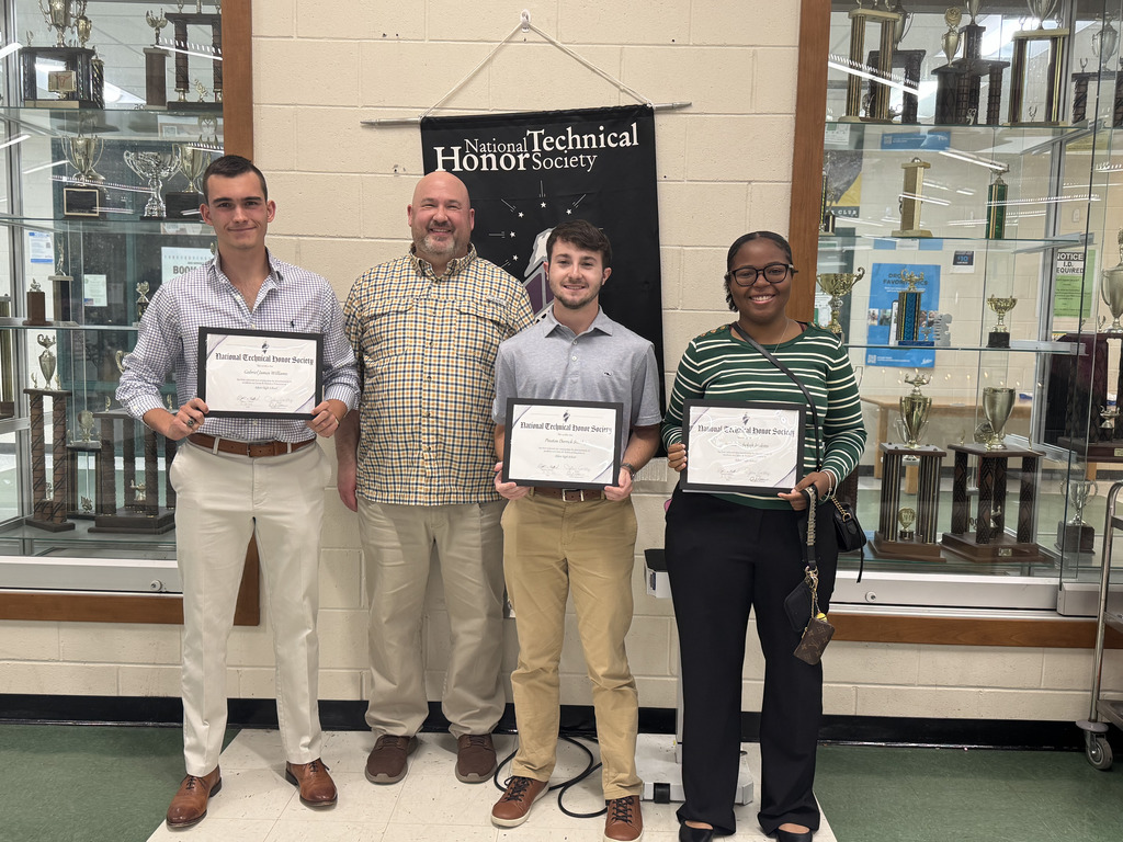 Students holding certificates