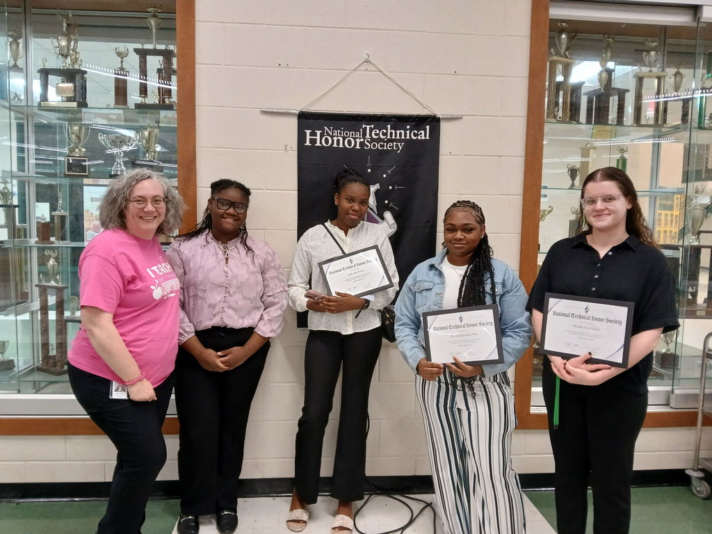 Students holding certificates