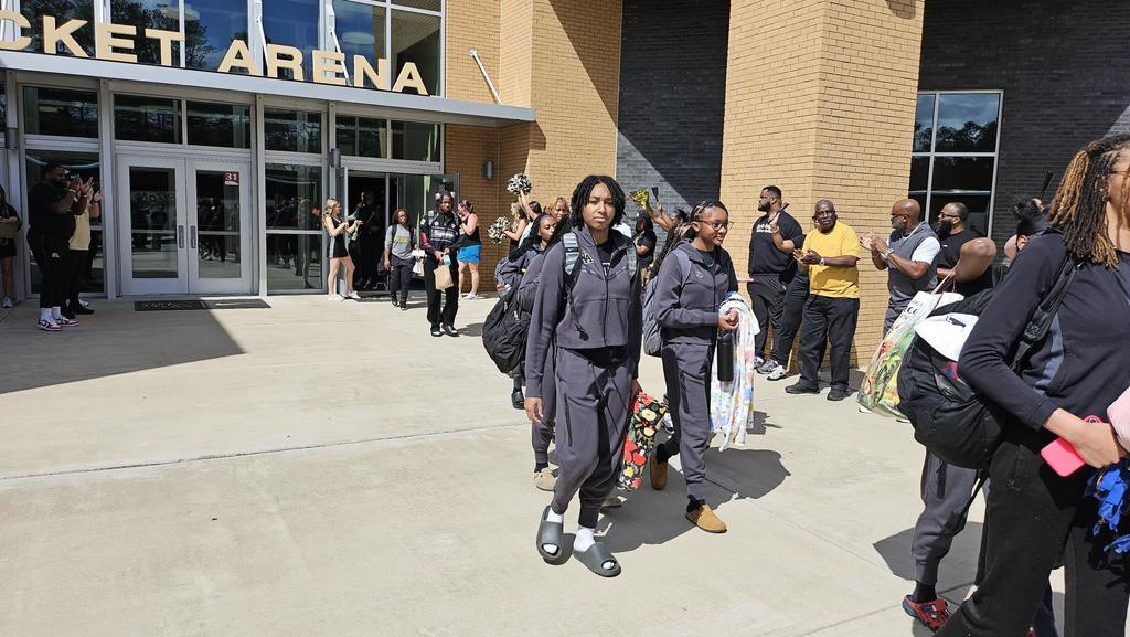 Girl Basketball Players being cheered off to state!