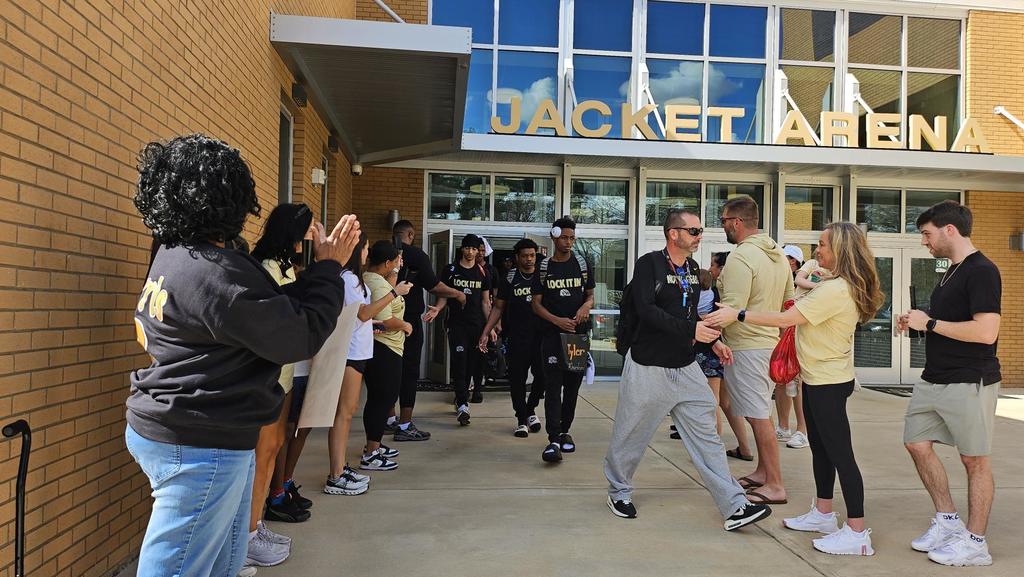 Boy Basketball Players Heading to State being cheered by fans! 