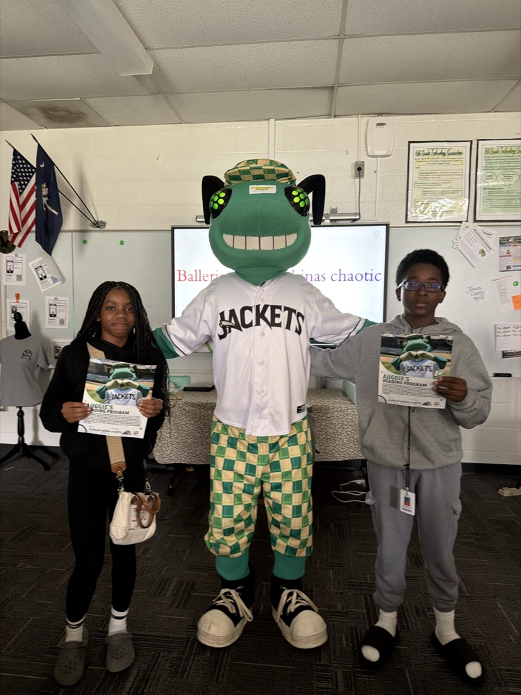 students posing with a baseball mascot that resembles a bug