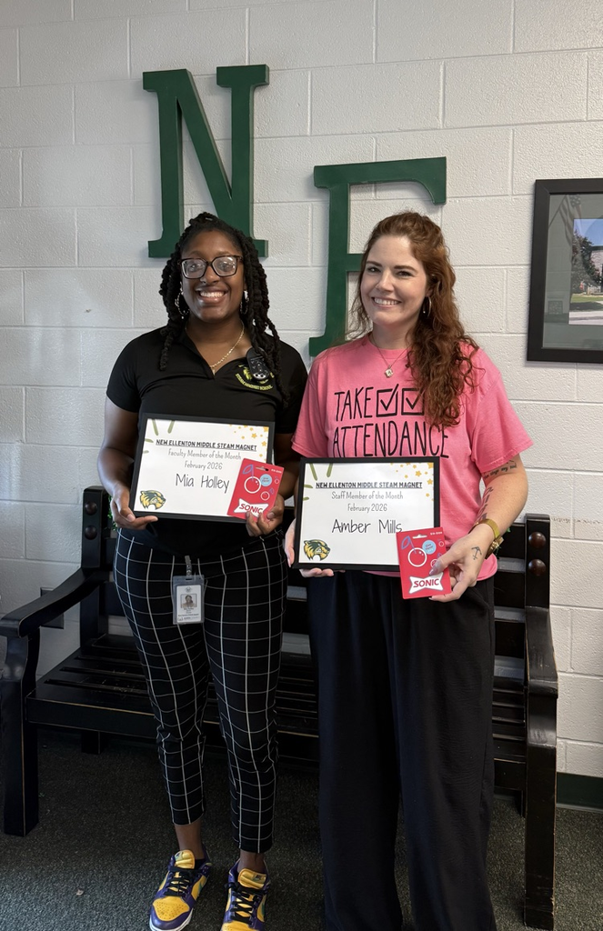 two adults holding certificates 