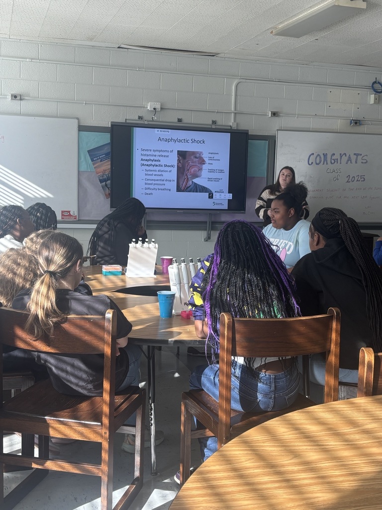 Students listening to a lecture about allergies.