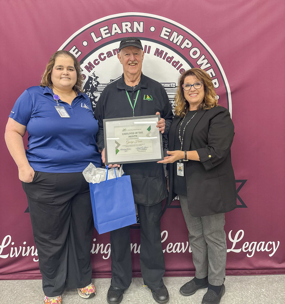 Child Nutrition Employee George Howe Stands with Child Nutrition Coordinator Polly Peyinghaus and Child Nutrition Field Supervisor Jenny Hill for a photo