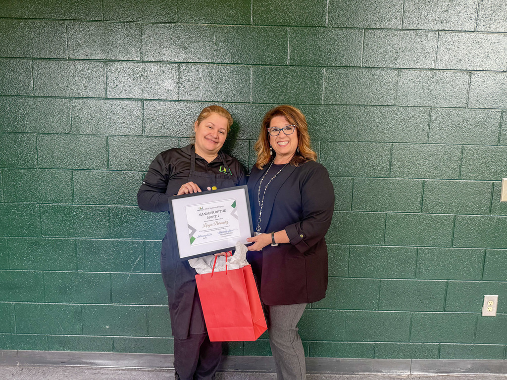 Child Nutrition Manager Lorgia Bermudez posing for a photo with Child Nutrition Coordinator Polly Peyinghaus