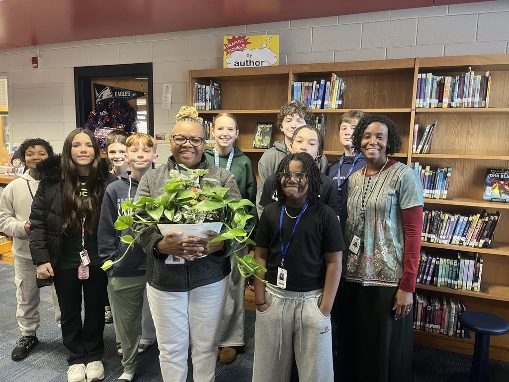 Students gifting Mrs. Crews a gift