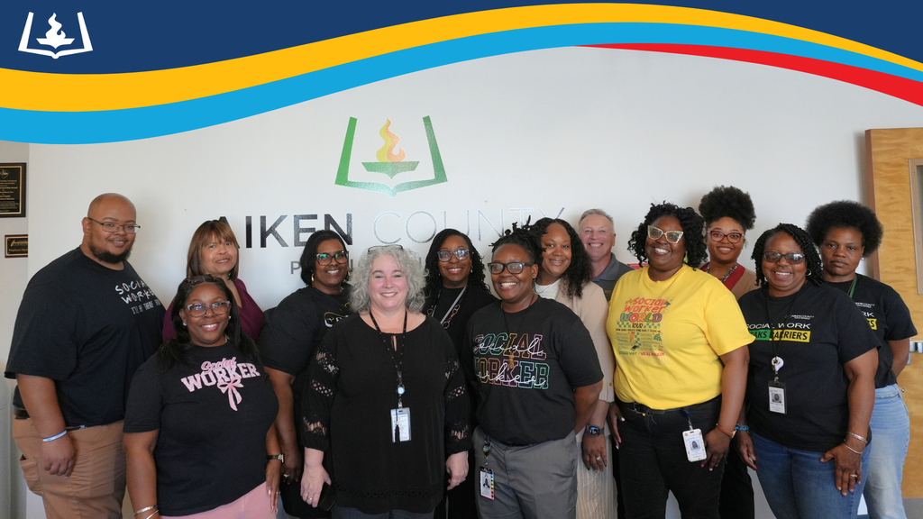 Group of school social workers and student services workers smiling.