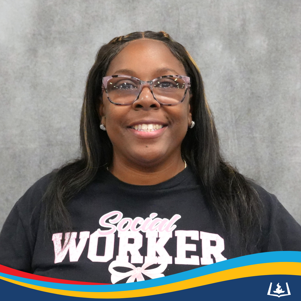 Keiautta smiling with social worker shirt.