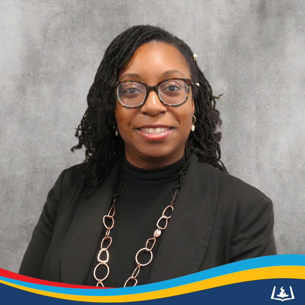 Deonna smiling in black blouse.