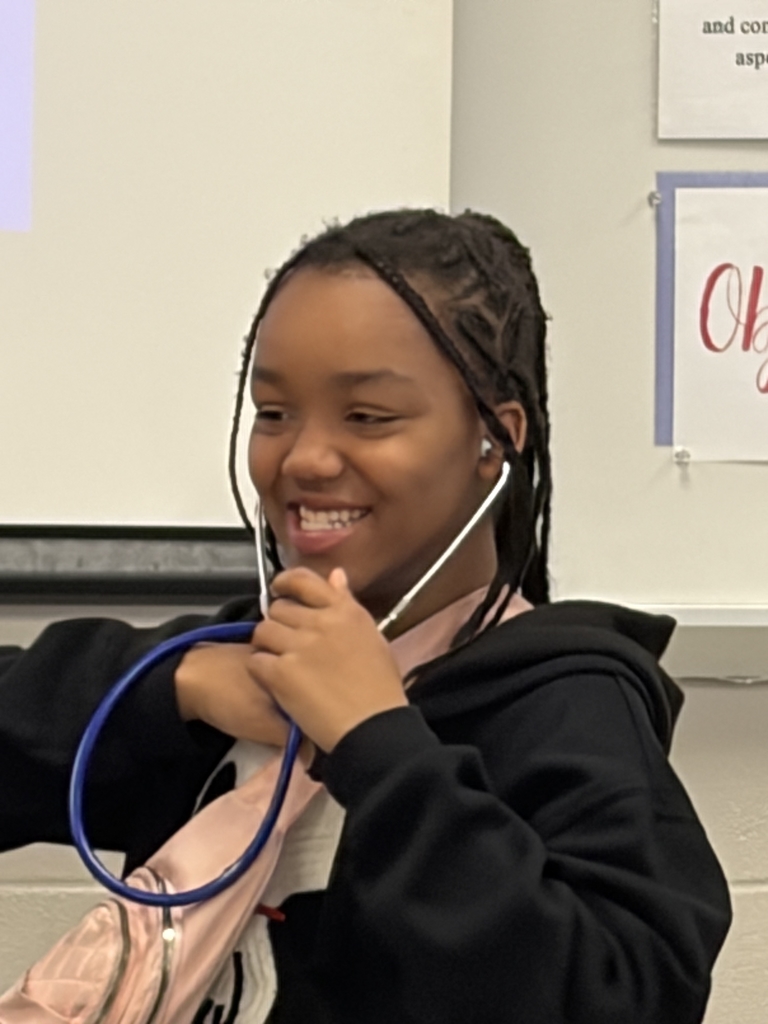 student checking heart beat