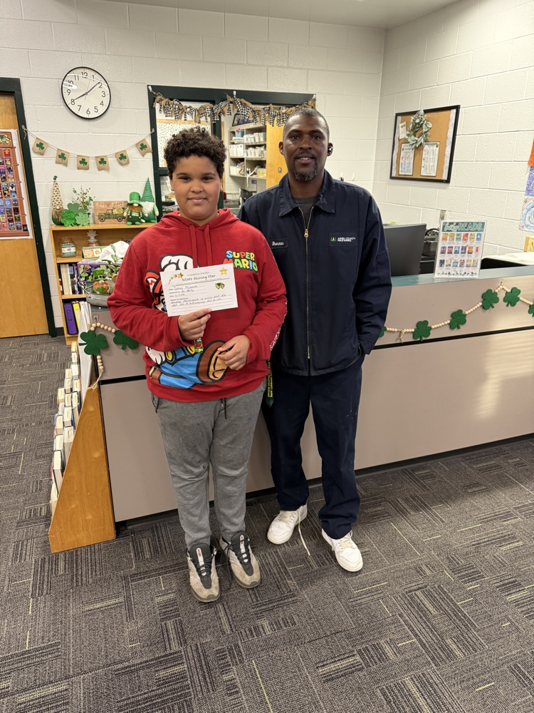 student posing with teacher 