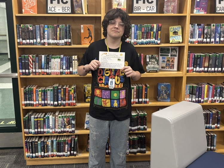 student posing with certificate 
