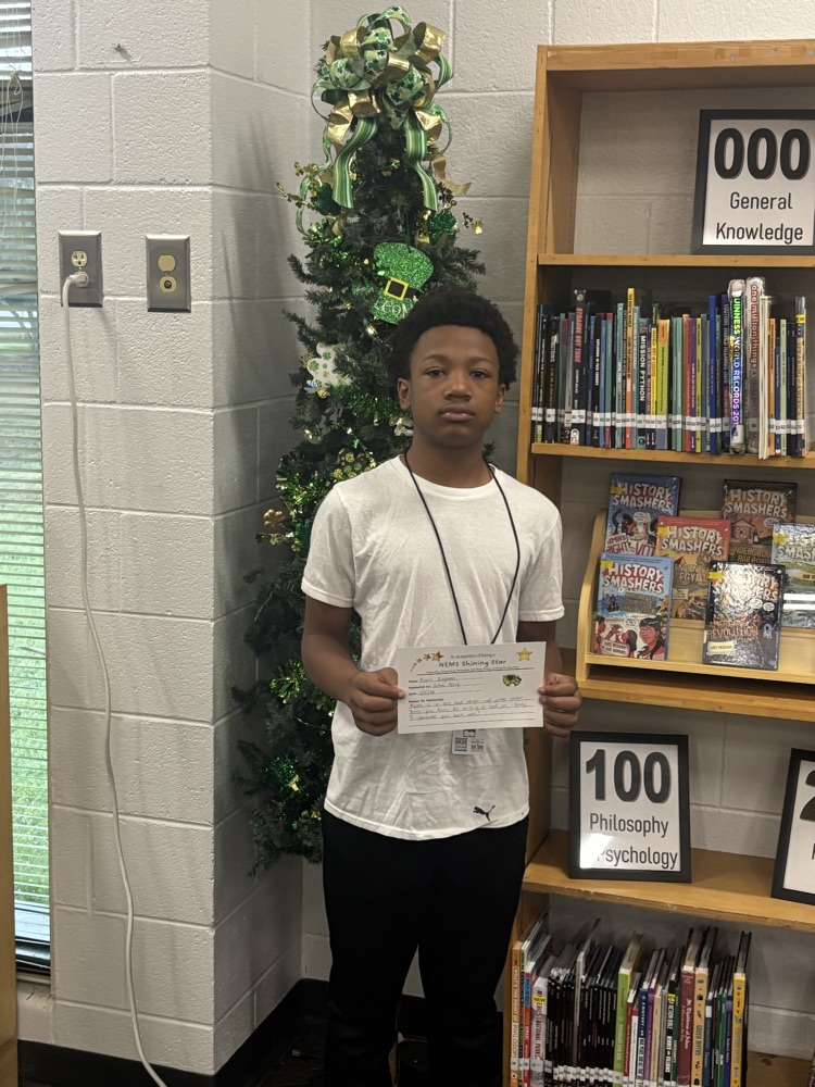 student posing with certificate 