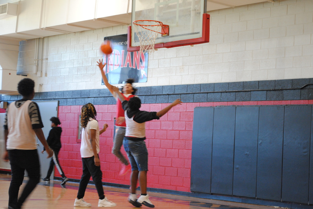 Basketball player shooting the ball.
