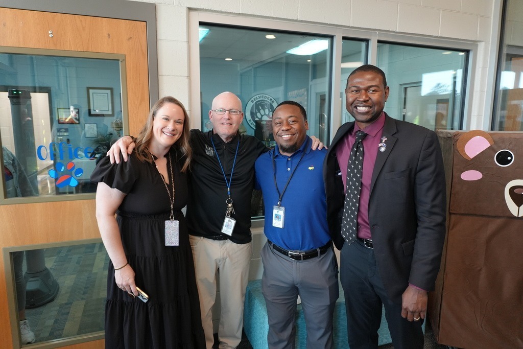 Area two council member smiling with vice principal of Belvedere.