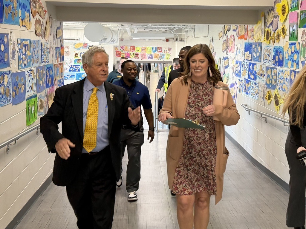 Principal of Belvedere walking down hallway with Congressman of South Carolina,