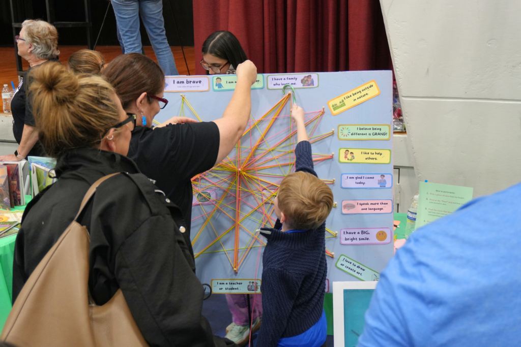 Student playing with string map.
