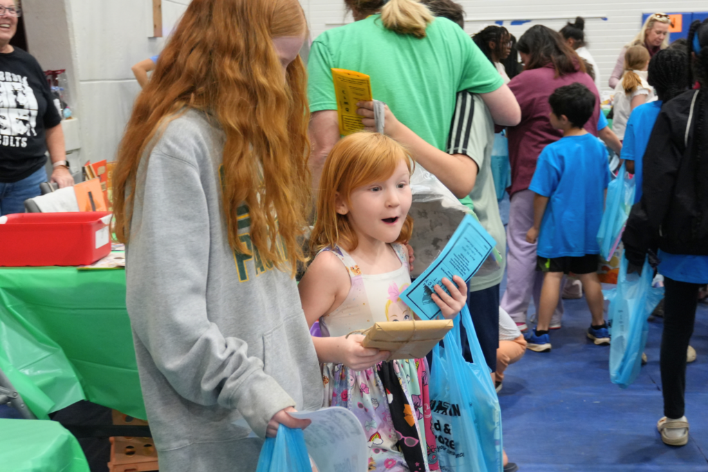 Student excited after winning raffle prize.
